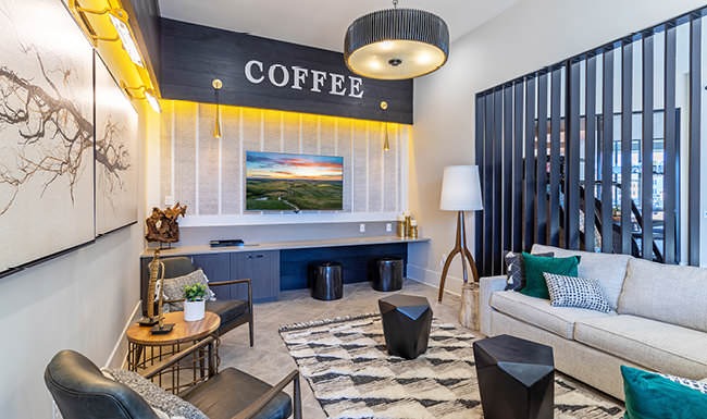 well lit coffee lounge with cushioned seats and couches