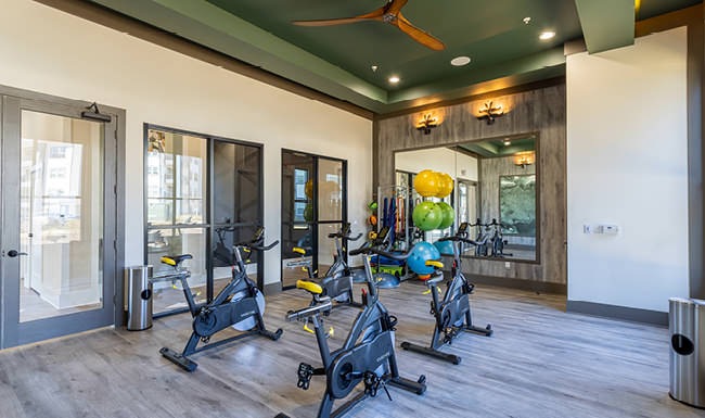 natural and recessed lighting fills studio with spin cycles